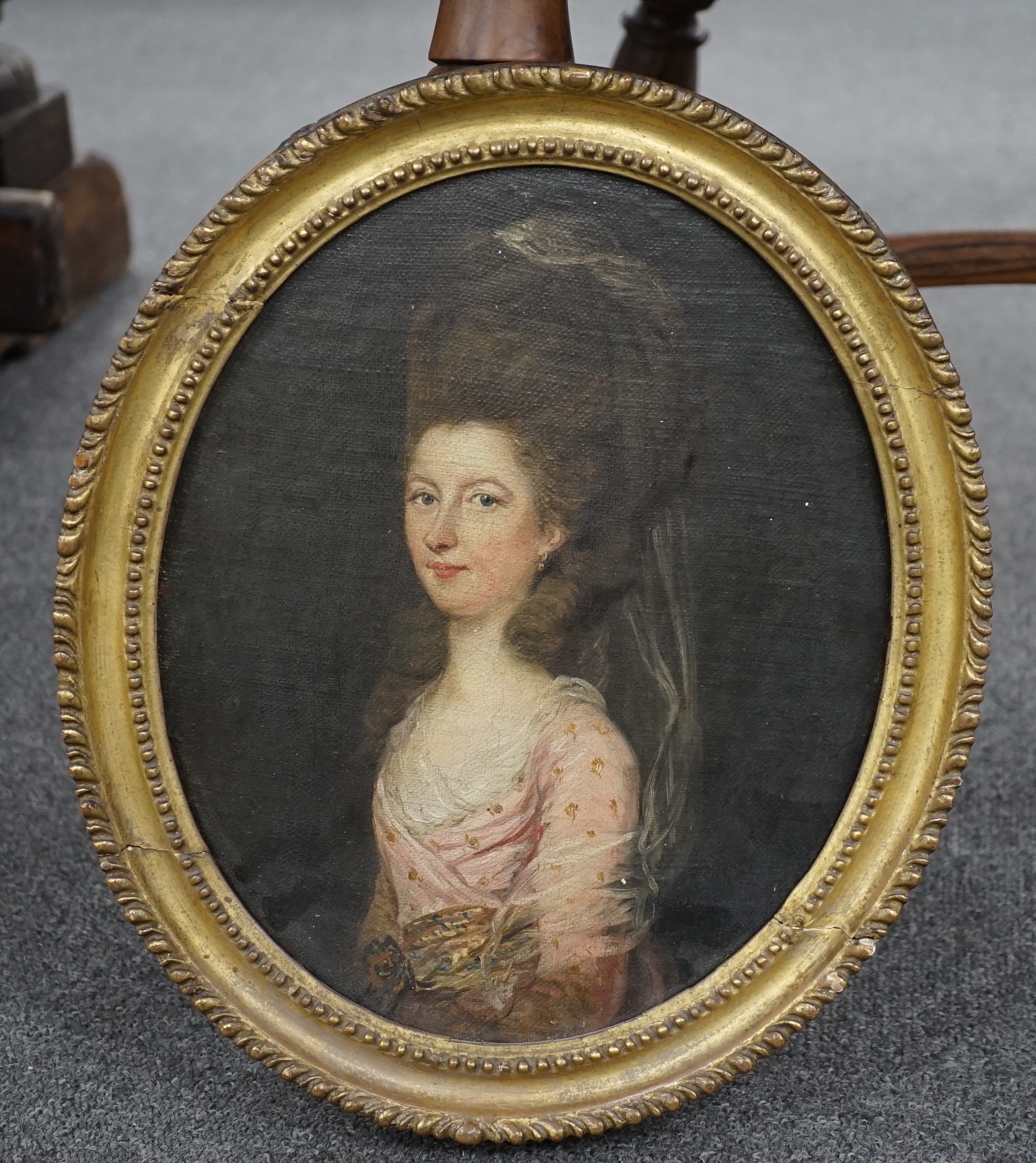 Late 18th/early 19th century English School, oil on canvas, laid onto wood panel, Portrait of a lady, Colonel W.D.Thompson label verso, oval, 28cm x 23cm